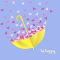 Motivation card Be happy. Bright yellow umbrella with pink hearts on blue background