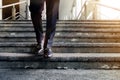 Motivation and challenging Career Concept. Steps into a Success. Low Section of Businessman Walking Down on Staircase. Male in Royalty Free Stock Photo