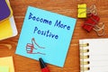 Motivation concept about Become More Positive with phrase on the piece of paper