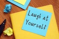 Motivation concept about Laugh at Yourself with phrase on the page