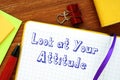 Motivation concept about Look at Your Attitude with inscription on the piece of paper