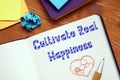 Motivation concept meaning Cultivate Real Happiness with inscription on the sheet