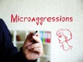 Motivation concept about Microaggressions with phrase on the sheet