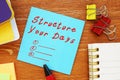 Motivation concept about Structure Your Days with phrase on the page