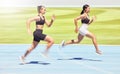 Motivation, energy and sports women runner training at racetrack, power and speed performance outdoor together. Freedom