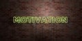 MOTIVATION - fluorescent Neon tube Sign on brickwork - Front view - 3D rendered royalty free stock picture