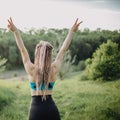 Sporty fit woman raising arms express positivity Royalty Free Stock Photo