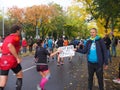 Motivation Marathon runners with cardboard Tap to Power up, female runner blurred taps the cardboard Royalty Free Stock Photo