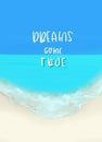 Motivation phrase hand drawn Dreams come true on the background of a sandy beach Royalty Free Stock Photo