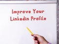 Motivational concept meaning Improve Your Linkedin Profile with phrase on the piece of paper