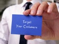 Motivational concept about Target Your Costumers with phrase on the piece of paper