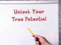 Motivational concept about Unlock Your True Potential with phrase on the sheet