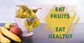 Motivational and educational sign: Eat fruit, eat healthy Royalty Free Stock Photo