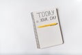 Motivational inscription in notepad TODAY IS YOUR DAY. Notebooks and pen. Handwriting