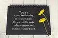 Motivational and inspirational quote on black note book with sunflowers. Royalty Free Stock Photo