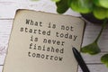 Motivational quote on burnt edge brown paper with blurred green plant Royalty Free Stock Photo