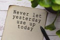 Motivational quote on burnt edge brown paper with blurred green plant Royalty Free Stock Photo