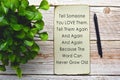 Motivational and inspirational quote on burnt edge paper with green plant Royalty Free Stock Photo