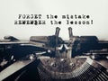 Motivational and inspirational quote of forget the mistake, remember the lesson in vintage background. Stock photo. Royalty Free Stock Photo