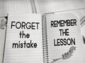 Motivational and inspirational quote of forget the mistake, remember the lesson written on notepad background. Stock photo. Royalty Free Stock Photo