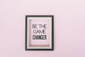 Motivational quotes - Be the game changer. Pink backgrounds Royalty Free Stock Photo