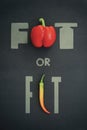 Motivational message diet gym training exercise concept  flat lay of red bell pepper and hot chilli pepperoni on black background Royalty Free Stock Photo