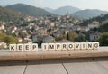 Motivational Message for Personal Growth and Continuous Improvement Displayed Outdoors Royalty Free Stock Photo