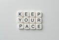 Motivational Message with Tiles: Keep Your Pace for Inspiration and Focus Royalty Free Stock Photo