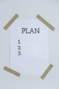 Motivational paper note PLAN. Goals setting concept. Strategy for self development improvement. Inspirational Planning Royalty Free Stock Photo