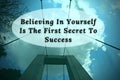 Motivational quote - Believing in yourself is the first secret to success. Blue sky and bridge background. Royalty Free Stock Photo