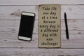 Motivational quote on burnt edge brown paper on wooden desk Royalty Free Stock Photo