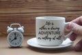 Motivational quote on coffee cup - Life is either a daring adventure or nothing at all.