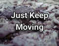 motivational quote - just keep moving. on abstract rocks background.