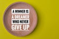 Motivational quote with phrase A WINNER IS A DREAMER WHO NEVER GIVE UP