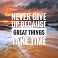 Motivational quote on sunset background - never give up because great things take time