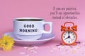 Motivational quote with white coffee cup with alarm clock set at 8 o'clock.