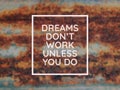 Motivational quote written with phrase DREAMS DON`T WORK UNLESS YOU DO Royalty Free Stock Photo