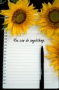 Motivational quote - you can do anything. Note to self concept with text on a notebook with pen and sunflowers.