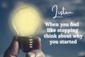 Motivational quote about when you feel like stopping with closeup light bulb background Royalty Free Stock Photo