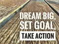 Motivational quotes on wood dream big set goal take action Royalty Free Stock Photo