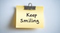 Motivational Yellow Sticky Note With Keep Smiling Message, Isolated On White Background. Close Up. Royalty Free Stock Photo