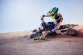 Moto cross, sand hill or man on bike for extreme sport workout, sunset ride or exercise on dirt. Nature, sky or person Royalty Free Stock Photo