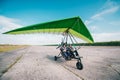 Moto hang-glider takes off on a ground airfield Royalty Free Stock Photo