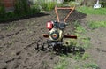 Moto plow or two-wheel tractor, walking tractor which can pull and power various farm implements such as a trailer, cultivator