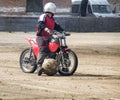 Motoball, man rides a motorcycle and drives a ball with him, close-up, ball