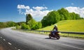 Motobike on asphalt road in beautiful summer evening Royalty Free Stock Photo