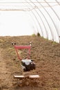 A motoblock cultivator for soil