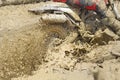 Motocross accelerating speed in mud Royalty Free Stock Photo