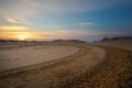 Motocross and auto sport track with sunset sky background. Royalty Free Stock Photo