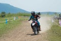 Motocross bike racer overtaking in high speed.